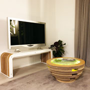 Design of the sample apartments with Lessmore eco-sustainable furnishings.  More-Bench: bench / TV stand in recyclable cardboard and Tappo. Design Giorgio Caporaso